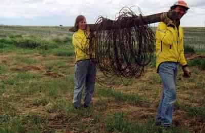 Randi (L) and Jeff tote that wire coil.