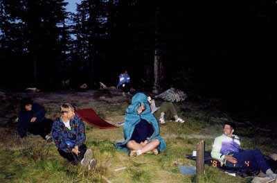 Unidentified Camper Inside Sleeping Bag on Cool Night at Lake Magog.