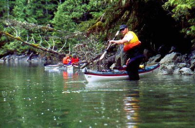 Doug mounts his kayak again after running the upstream rapids.
