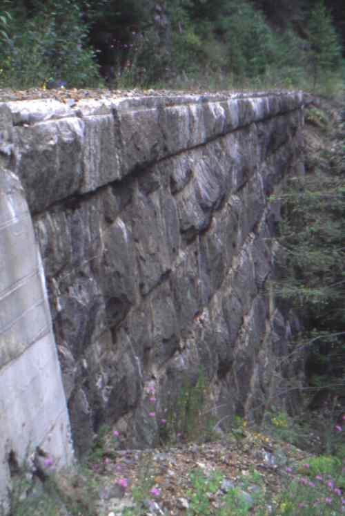 Precision crafted retaining wall, constructed 
by Italian stone masons, overlooking Christina Lake.